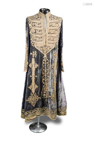 A late 19th century Hazara woman's wedding dress, the velvet gown adorned with couched gold