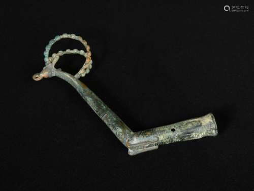 A Luristan bronze whetstone handle, circa 900-700 BC, ibex-shaped with large beaded horns, a long