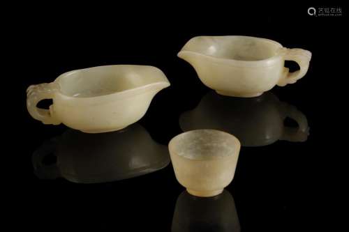 TWO MING STYLE CELADON JADE LIBATION CUPS, EARLY 20TH CENTURY