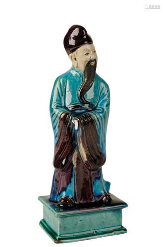 TURQUOISE AND AUBERGINE-GLAZE POTTERY FIGURE, KANGXI PERIOD