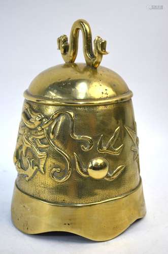 A Korean, or other Asian, metal bell; the bell decorated with a dragon and flaming pearlSome wear,