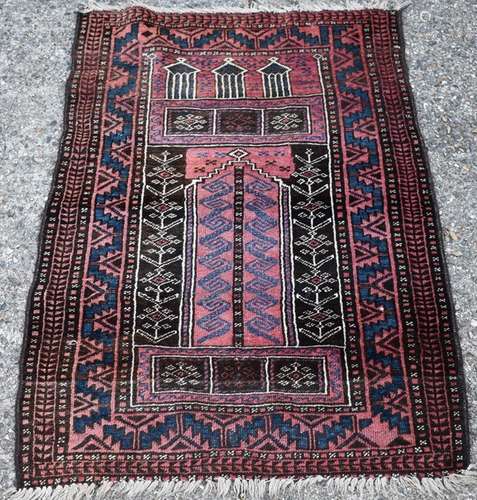 An Afghan Baluch prayer rug, circa 1920, with repeating boders, 130 x 93 cm [369]