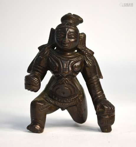 A small, Indian bronze figure of the young Krishna, holding the butterball with his right hand, 9 cm