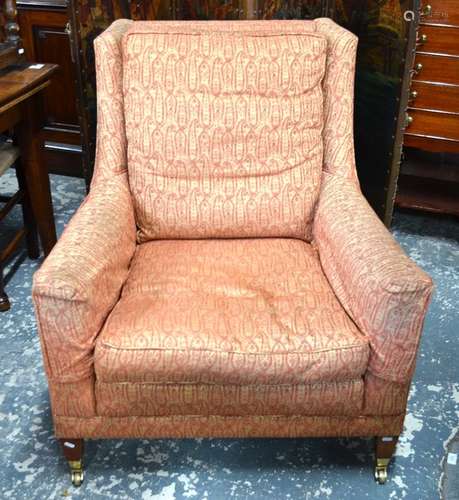 A contemporary Duresta brand armchair, upholstered in patterned bronze/orange Liberty style