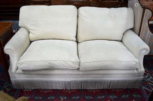 George Smith Ltd., a contemporary two seater sofa upholstered in oatmeal chenille fabric with all-