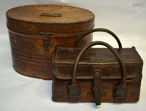 A heavy leather, canvas and metal lined military small case stamped CO1944 C^897, an oval painted