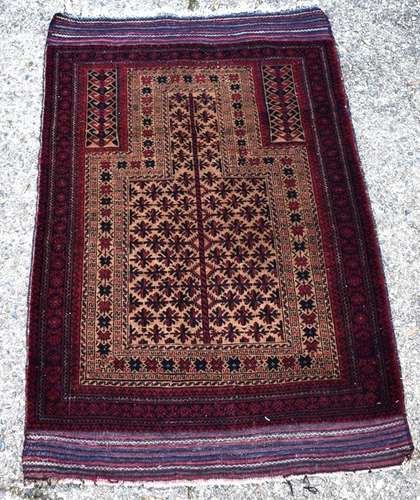 An Afghan Baluch prayer rug, circa 1920, the central reserve with repeating star like motif with