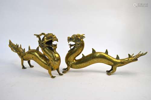 A pair of Asian brass sculpture, designed as dragons, 35 cm long (2)