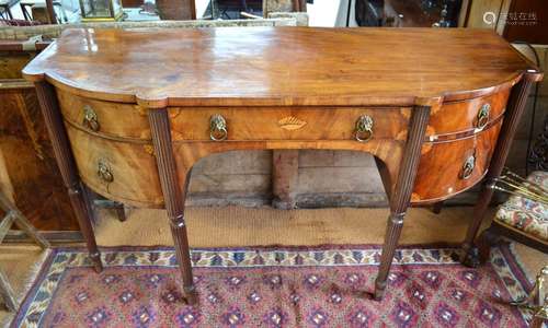 A George III satinwood inlaid mahogany bowfront sideboard with six drawers, raised on six turned and