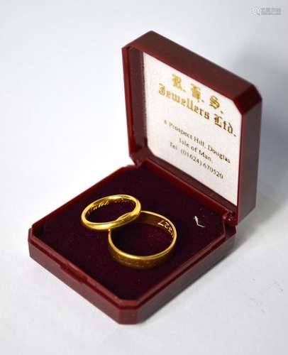 A 22ct yellow gold wedding band, size I to/w another 22ct yellow gold wedding band with engraved