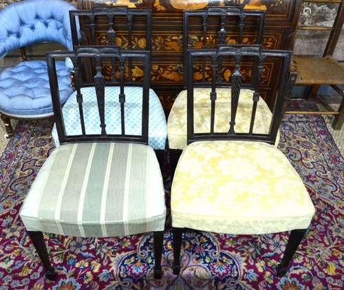 A set of four mahogany Hepplewhite style dining side chairs, with moulded vertical splats over