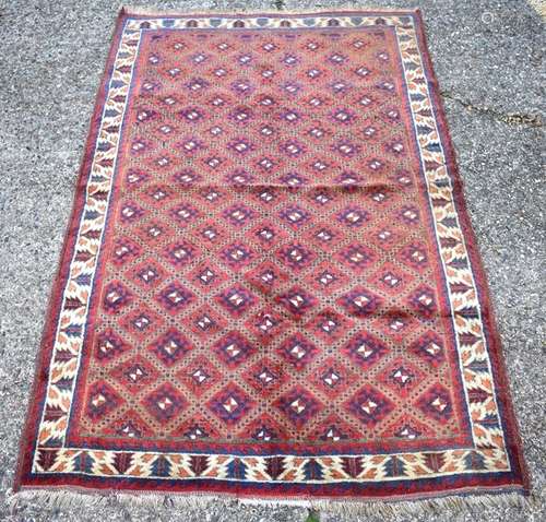 A Uzbek Karakalpak rug, circa 1930, the central reserve with central diamond motif and ivory border,