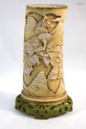 A late 19th/early 20th century porcelain vase in the form of an elephant ivory tusk, possibly