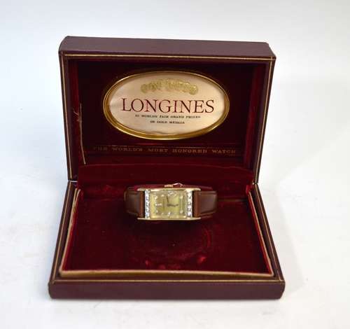 A vintage Longines boxed 14k wristwatch with diamond-set rectangular champagne dial with rows of