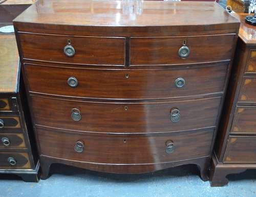 A 19th century mahogany bowfront chest of two short over three long graduated drawers on splayed