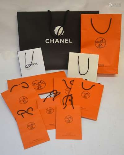 A large collection of designer merchandise carrier bags mostly Chanel (some with camellia flower