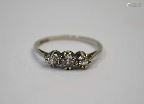 A three-stone old cut diamond ring, white gold set, size RThe central diamond with crack breaking