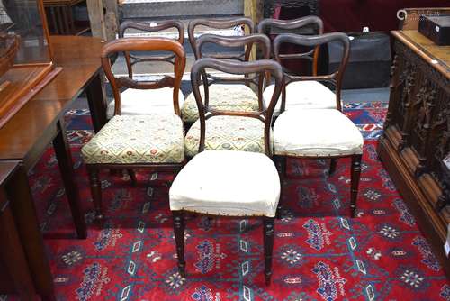 A set of seven Victorian rosewood framed side chairs, with ovoid open back frames over overstuffed