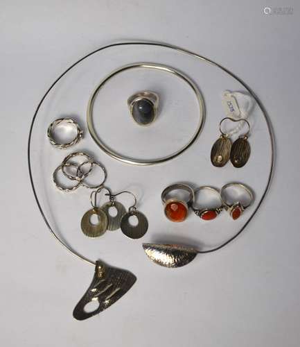 A collection of various contemporary silver and white metal jewellery items including a torque