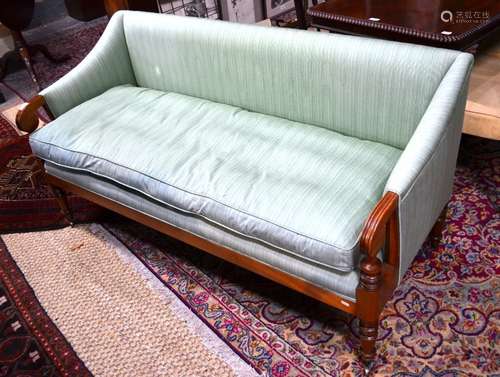 A contemporary Victorian style pale green upholstered bench sofa raised on turned hardwood front