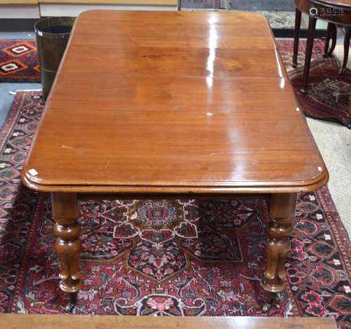 A Victorian mahogany draw leaf dining table, the top with rounded corners and twin moulded edge,