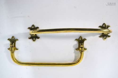 A pair of hinged brass umbrella stand brackets