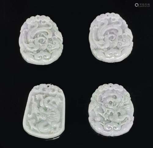 Group of Four Chinese Carved Jadeite Pendants