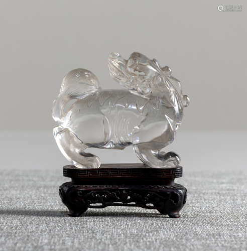 A CARVED CLEAR ROCK CRYSTAL MODEL OF A STANDING LUDUAN