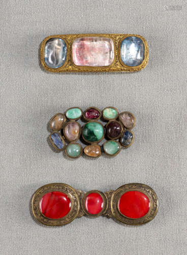 A GROUP OF THREE STONE-INSET PART-GILT BRONZE BELT BUCKLES
