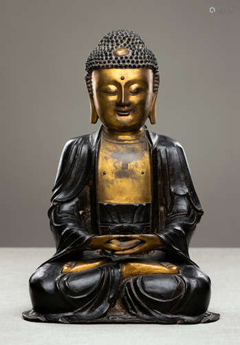 A PART-GILT BRONZE FIGURE OF SEATED BUDDHA