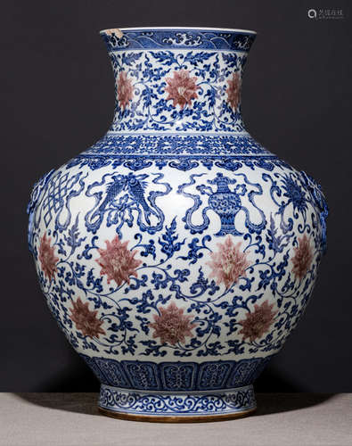 A LARGE BLUE AND WHITE AND COPPER-RED DECORATED HU-SHAPED LOTOS AND BUDDHIST EMBLEM VASE