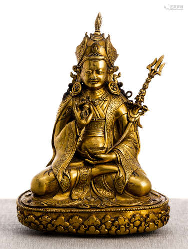 A GILT-BRONZE FIGURE OF PADMASAMBHAVA