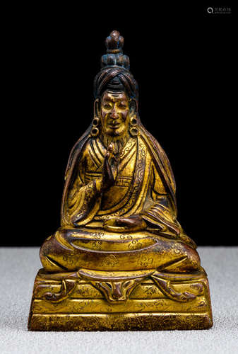 A RARE GILT-BRONZE FIGURE OF A YOGI