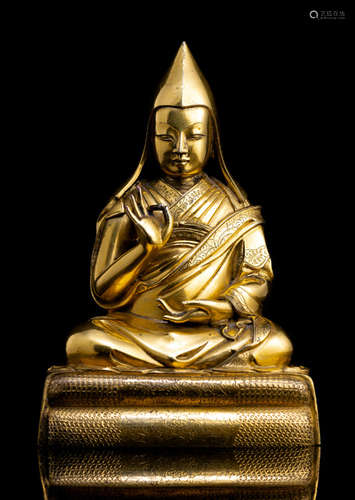 A FINE GILT-BRONZE FIGURE OF A LAMA