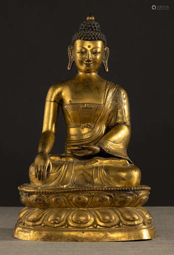 A GILT-BRONZE EMBOSSED FIGURE OF BUDDHA SHAKYAMUNI