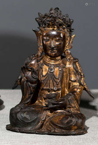 A GILT-LACQUERED BRONZE FIGURE OF GUANYIN