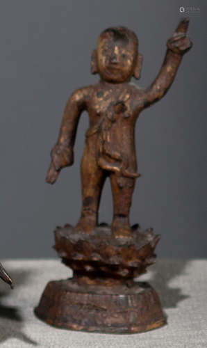 A BRONZE FIGURE OF THE INFANT BUDDHA