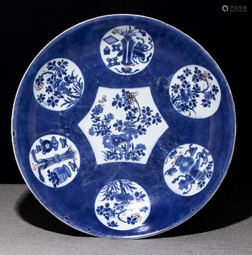 A POWDERBLUE-GROUND PORCELAIN PLATE WITH FLOWER MEDAILLONS WITH COPPER-RED