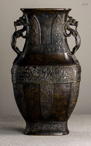 A HU-SHAPED BRONZE VASE WITH DRAGON HANDLES IN ARCHAIC STYLE