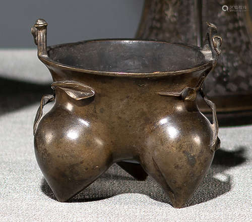 A PEACH-SHAPED BRONZE TRIPOD CENSER