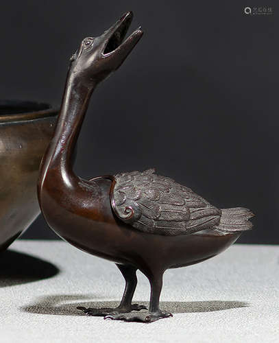 A DUCK-SHAPED TWO-PART BRONZE CENSER