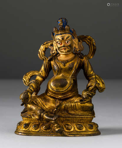 A GILT-BRONZE FIGURE OF JAMBHALA