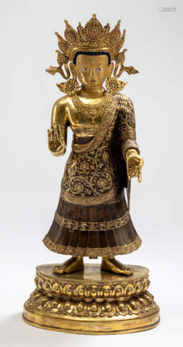 A GILT-BRONZE FIGURE OF THE DIPANKARA BUDDHA