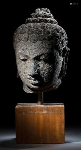 A VOLCANIC STONE HEAD OF BUDDHA SHAKYAMUNI