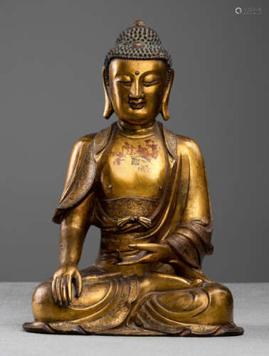 AN IMPORTANT GILT-BRONZE FIGURE OF BUDDHA SHAKYAMUNI