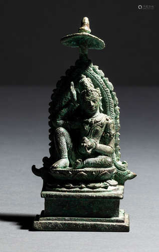 A BRONZE FIGURE OF AWALOKITESHWARA