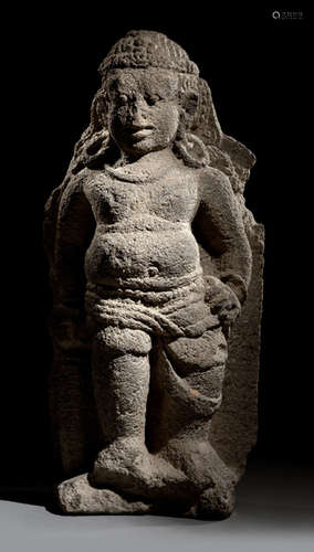 A VOLCANIC STONE FIGURE OF A GUARDIAN