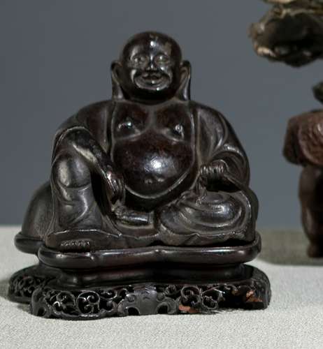 A BRONZE MODEL OF BUDAI