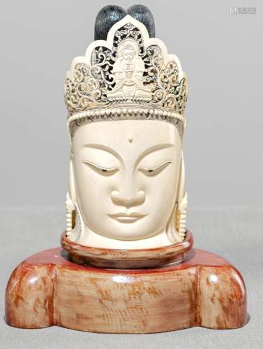AN IVORY HEAD OF GUANYIN WITH AMITABHA IN THE CROWN