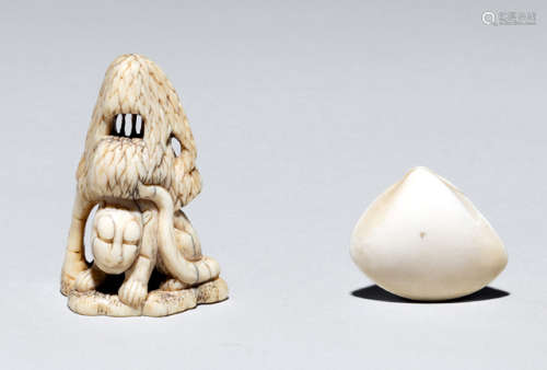 TWO IVORY NETSUKE OF A TIGER SEATED IN A BAMBOO GROVE AND A SHELL